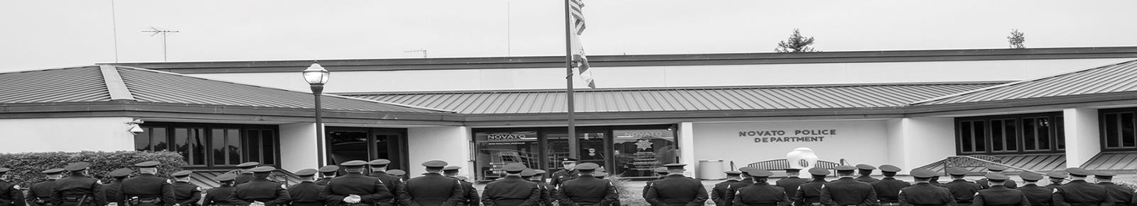Police staff in front of the Police Department